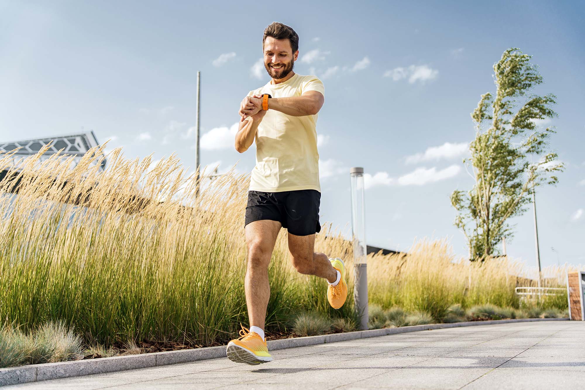 Man running outdoors, showing physical health as a foundation for self-improvement.