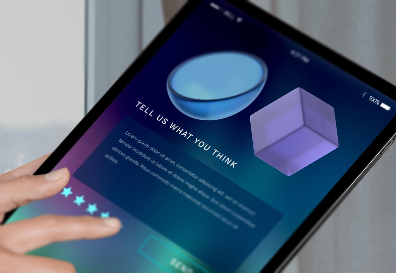 Close-up of a hand using a tablet interface with a feedback form, showing star ratings and the phrase “Tell us what you think,”, taking feedback constructively.