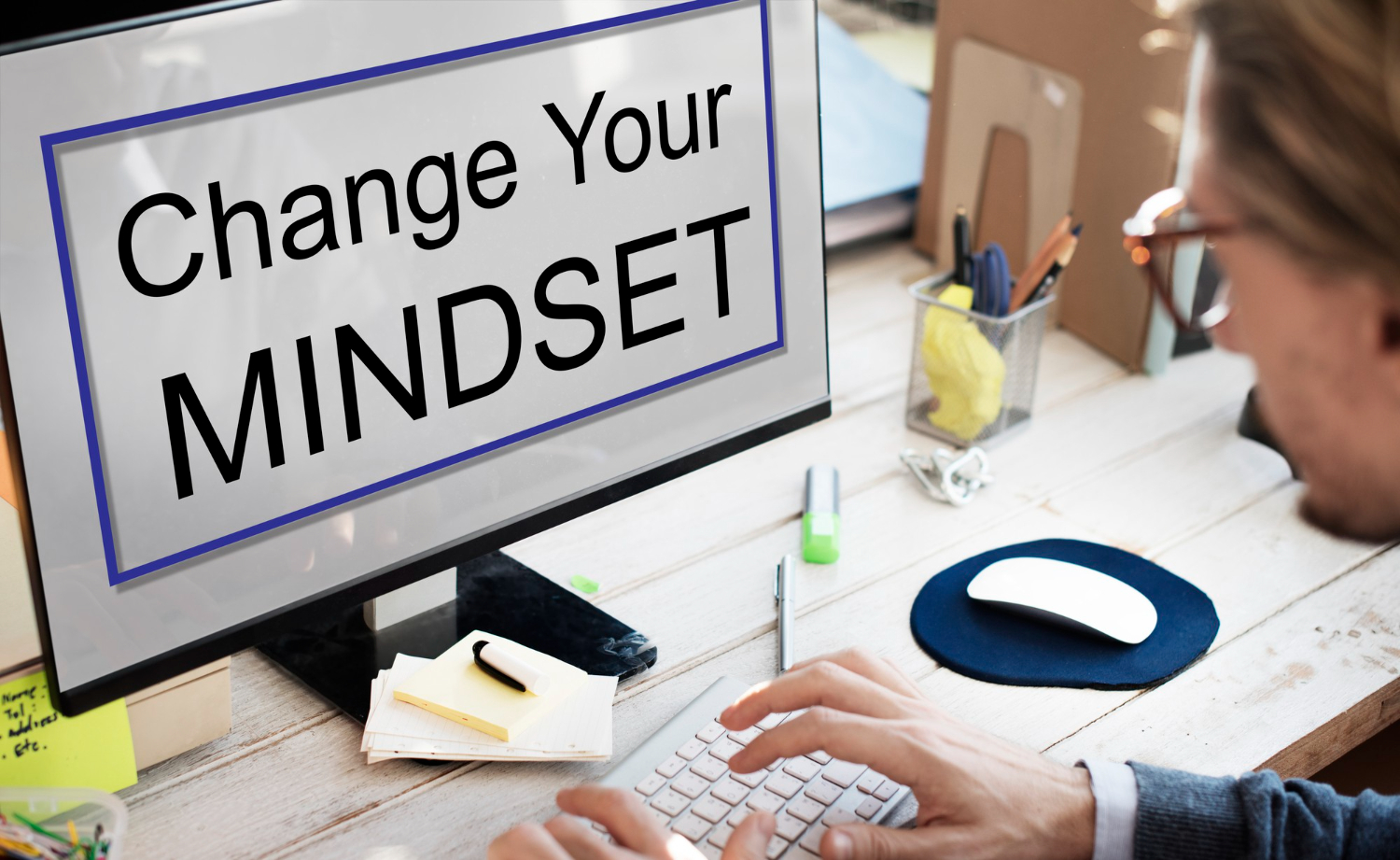 Computer screen displaying “Change Your Mindset” as a reminder to shift away from limiting beliefs.